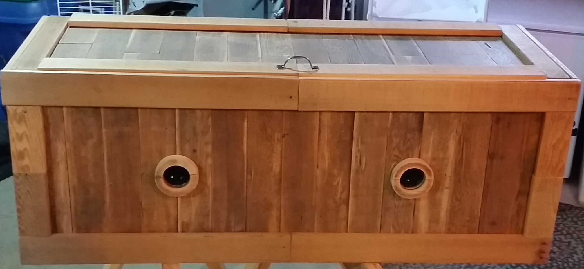 The construction allows for it to be used as a bench. That is why there is no vent in the top. The over all weight is a two person lift. vermicomposting bins